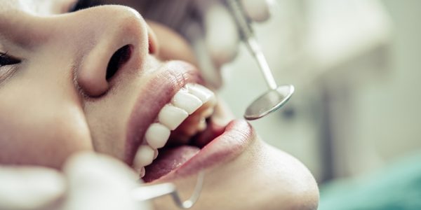 Dentists treat patients' teeth.